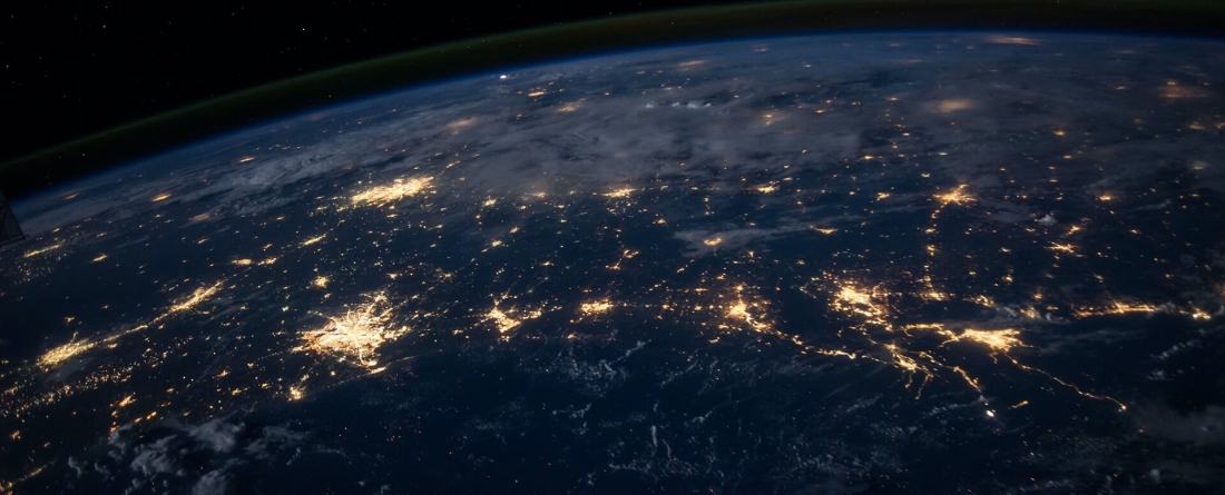 Earth as seen from space with cities glowing brightly
